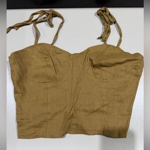 Taupe crop top. With tie straps and zipper in the side